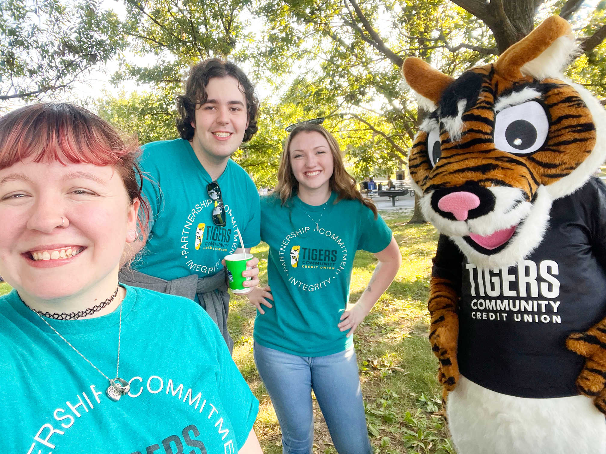 3 Tigers Community staff members and our Tigersquirrel® mascot volunteering at Columbia's Family Fun Fest on a beautiful summer evening.