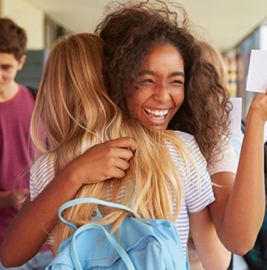 2 high school girls celebrating 