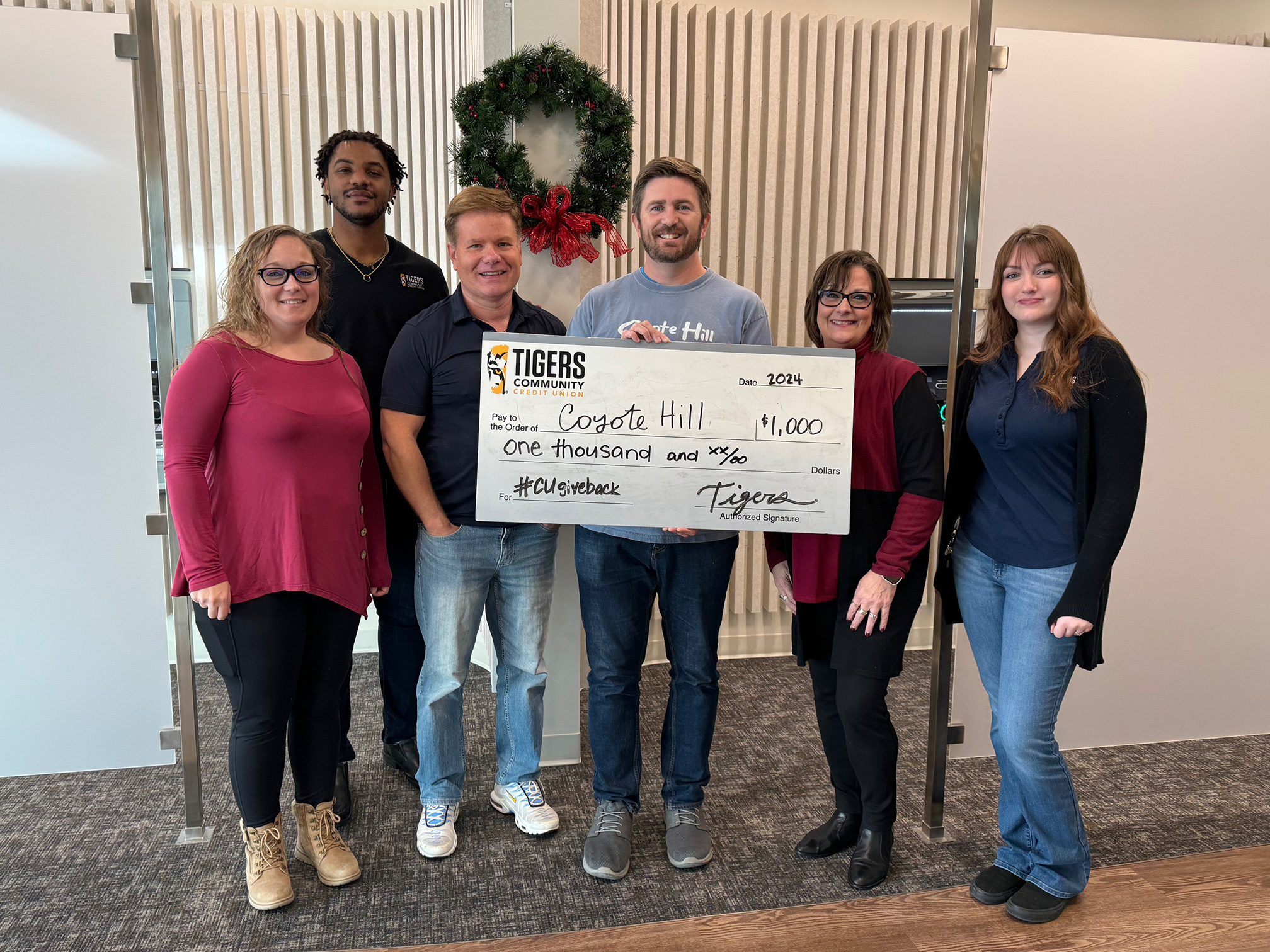 Denim for Dollars donation to Coyote Hill in Columbia.